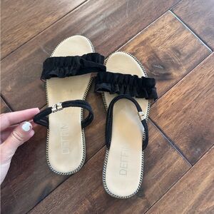 Black ruffle sandals
